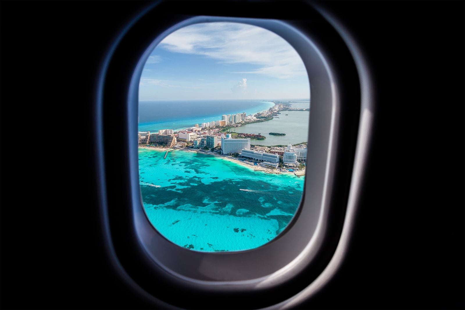 Cancun beach view from jet plane window